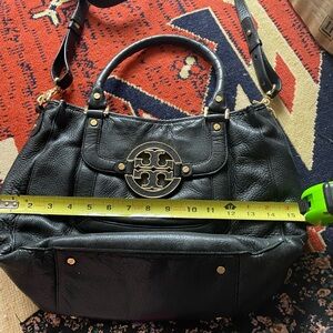 Tory Burch crossbody pebbled-leather black bag with large emblem on front pocket